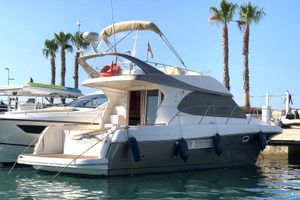 Jeanneau Prestige 36 2006 Jeanneau Prestige 36 yacht docked at marina with palm trees.
