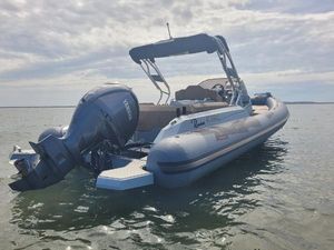 Ranieri cayman 27' 2023 Ranieri Cayman 27' boat with Yamaha engine on calm water.