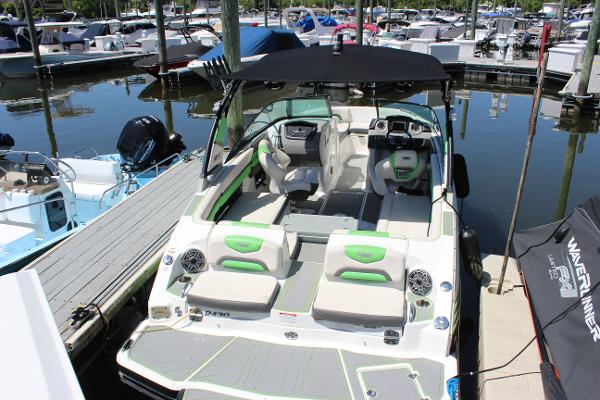 Chaparral Vortex 2430 VRX 2017 Chaparral Vortex 2430 VRX boat docked at marina, featuring spacious seating and modern design.