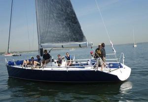 Ker 11.3 Sailing on a 2001 Ker 11.3 yacht with crew on calm waters.
