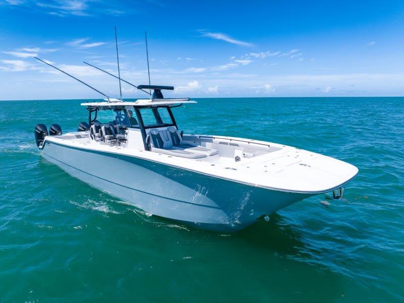 Invincible 46 Catamaran 2025 Invincible 46 Catamaran cruising on open ocean under clear blue sky.
