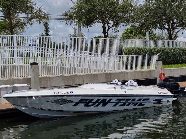 Apache 28 Brave w/ Twin 300x Mercs 1991 Apache 28 Brave boat with twin 300x Mercs, docked by a white fence.