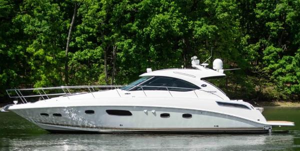 Sea Ray 470 Sundancer 2010 Sea Ray 470 Sundancer yacht cruising on a serene lake.