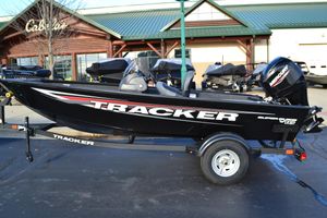 Tracker Super Guide V-16 SC 2026 Tracker Super Guide V-16 SC boat on trailer outside Cabela's store.