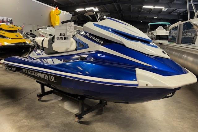 Yamaha WaveRunner GP1800 2018 Yamaha WaveRunner GP1800 in showroom, blue and white, displayed on stand.