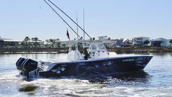 Invincible 35 Catamaran Invincible 35 Catamaran 2021 cruising on water, featuring sleek design and powerful engines.