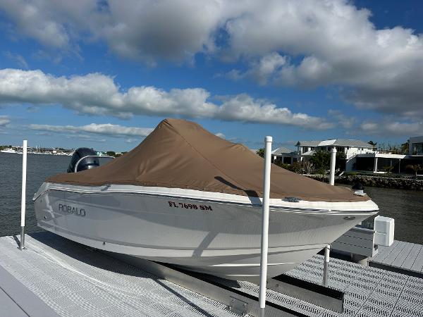 Robalo R180 Center Console 2018 Robalo R180 Center Console boat with cover on dock.