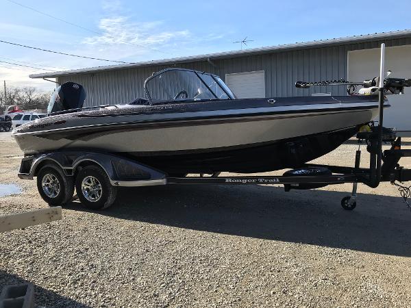 Ranger 1880MS 2025 Ranger 1880MS boat on trailer, parked outdoors near a building.