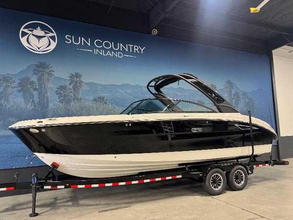 Sea Ray SDX 270 Surf 2025 Sea Ray SDX 270 Surf boat on trailer at Sun Country Inland showroom.