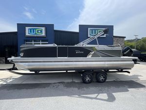 Tahoe Pontoon 25 LSZ QL 2024 Tahoe Pontoon 25 LSZ QL boat on trailer outside dealership.