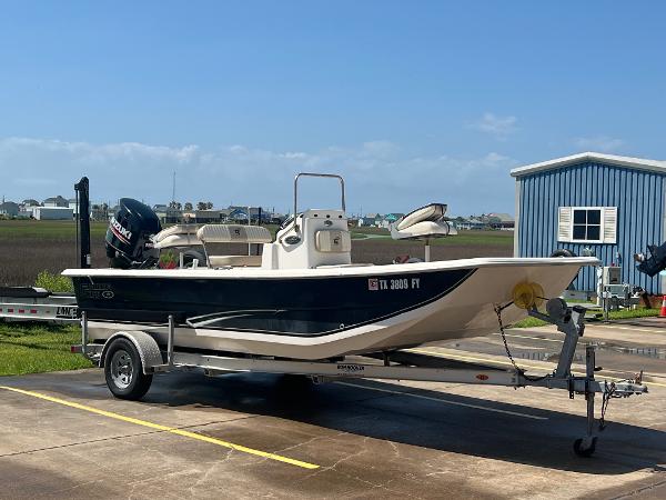Carolina Skiff 19 SWS 2019 Carolina Skiff 19 SWS boat on trailer, parked outdoors under clear sky.