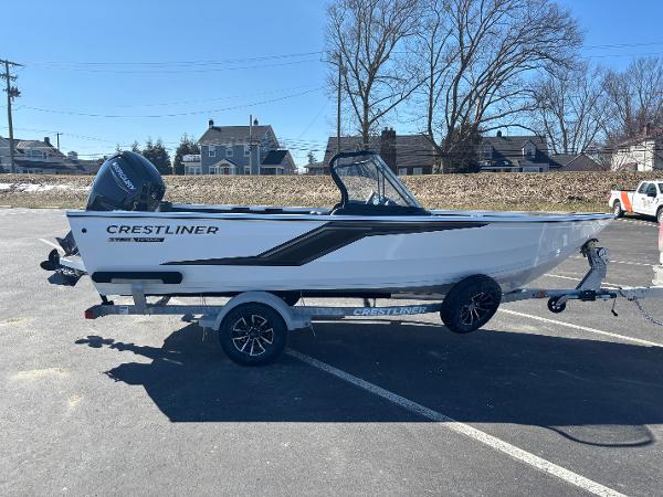 Crestliner 1750 Hawk 2025 Crestliner 1750 Hawk boat on trailer in sunny parking lot.