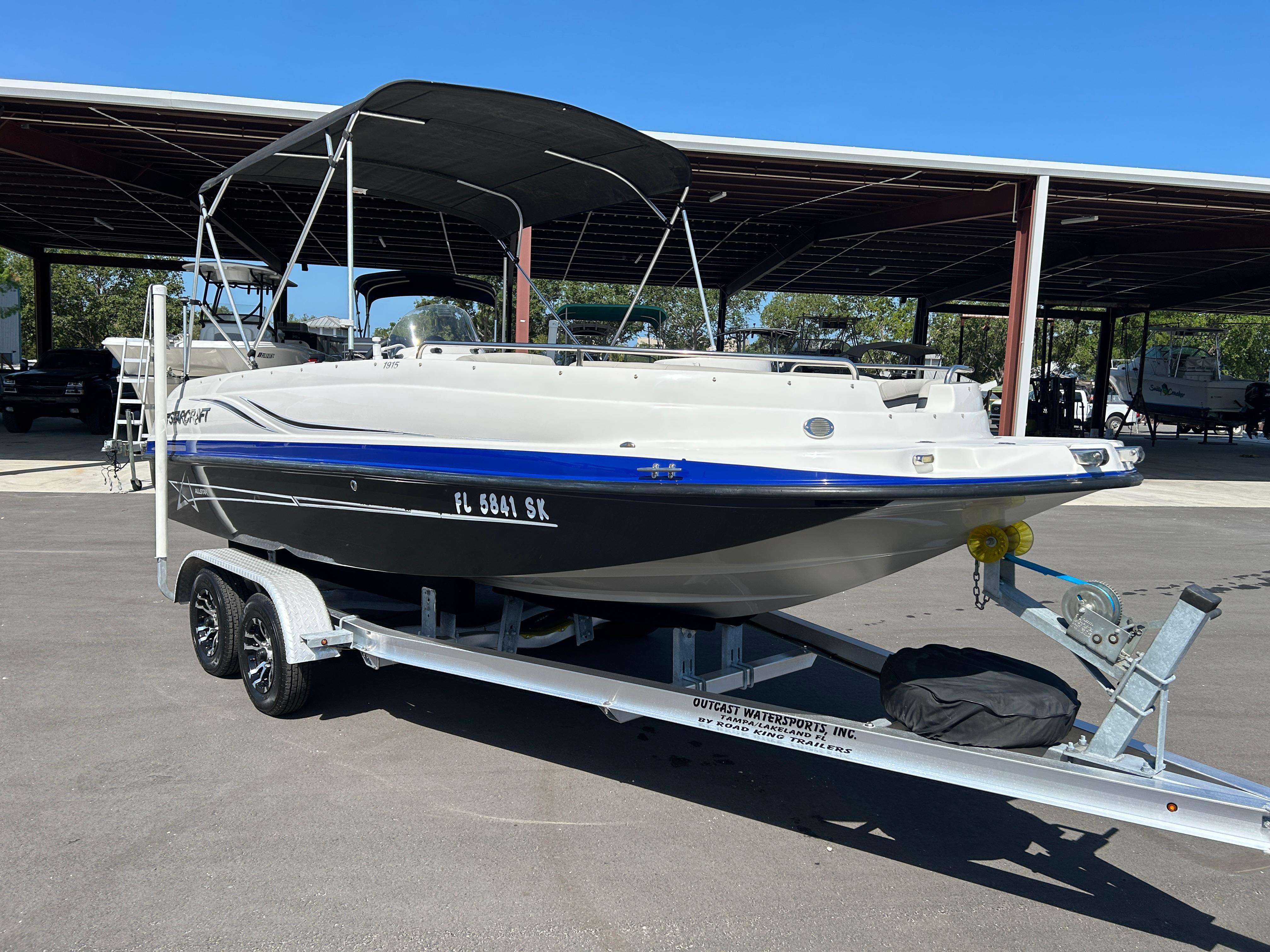 Starcraft Limited 1915 OB 2019 Starcraft Limited 1915 OB boat on trailer under canopy.