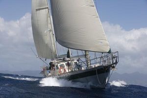Aluminum Cruiser Ted Brewer Sailing yacht "Aluminum Cruiser Ted Brewer 2005" navigating through ocean waves.