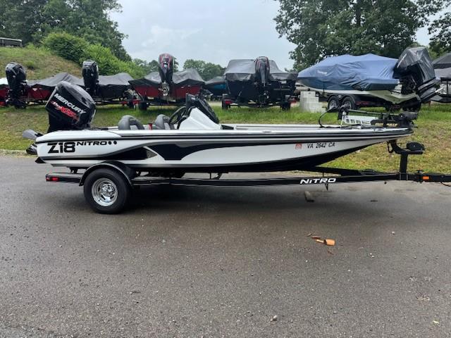 Nitro Z18 2016 Nitro Z18 boat on trailer, parked outdoors with other boats in the background.