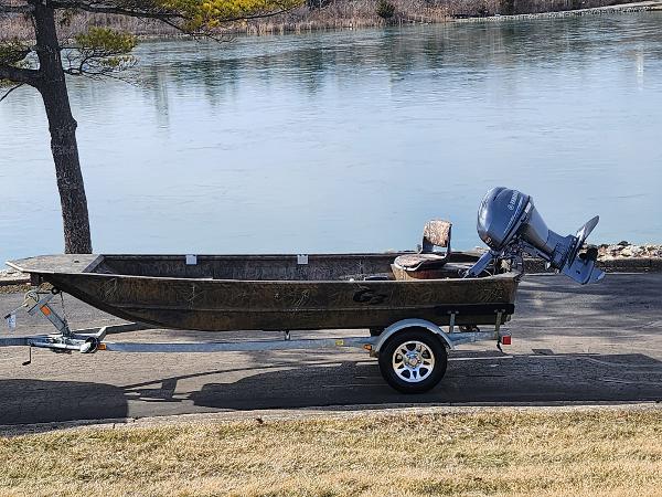 G3 Gator Tough 15 DK 2019 G3 Gator Tough 15 DK boat on trailer by a lake.