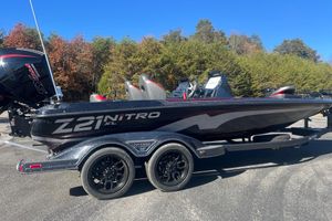 Nitro Z21 XL Pro 2026 Nitro Z21 XL Pro boat on trailer, parked outdoors with trees in background.