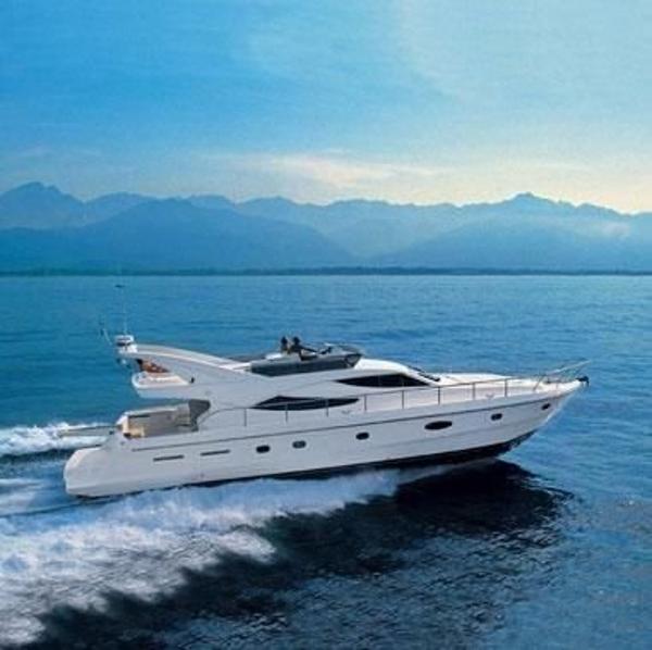 Ferretti Yachts 620 Ferretti Yachts 620 cruising on open water, 2000 model, scenic mountain backdrop.