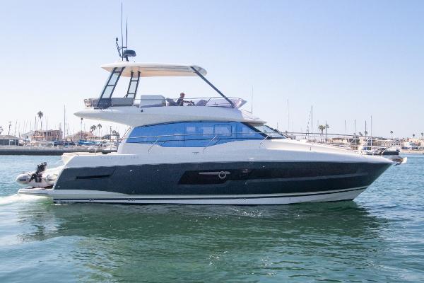 Prestige 460 Fly 2020 Prestige 460 Fly yacht cruising in a marina.