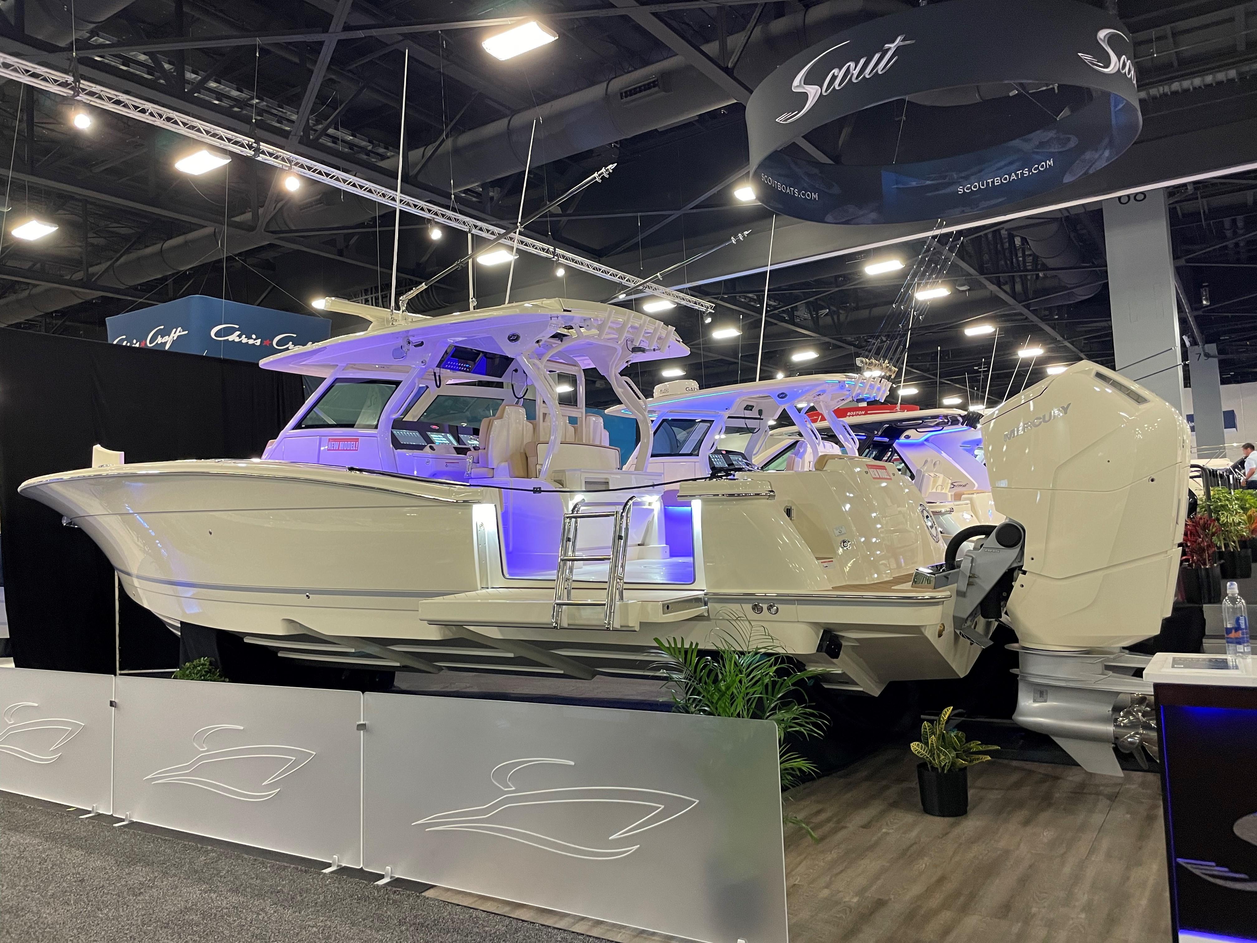 Scout 400 LXF 2025 Scout 400 LXF luxury boat displayed at an indoor boat show.