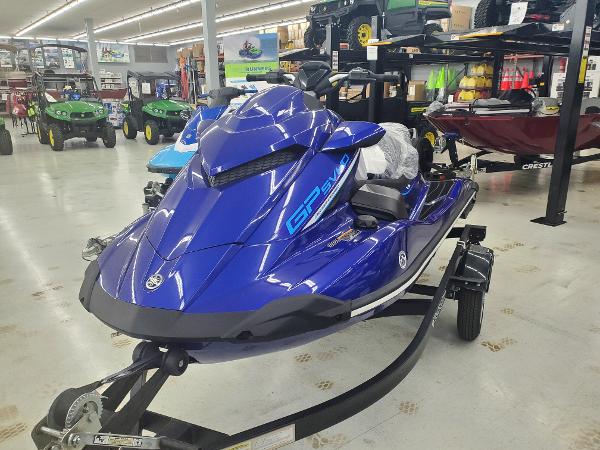 Yamaha WaveRunner GP 1800C 2024 Yamaha WaveRunner GP 1800C in showroom, blue jet ski on trailer.