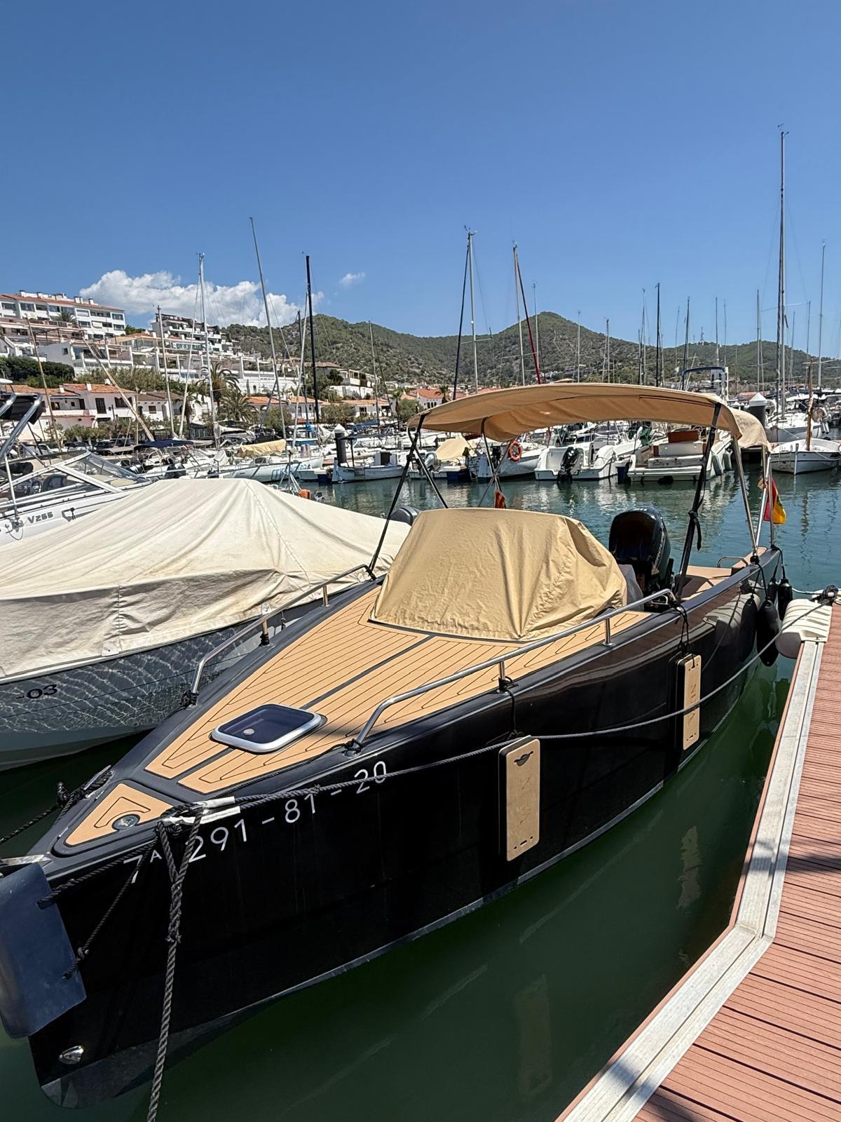 Nuva M 6 Nuva M 6 boat docked at marina, 2020 model, with scenic background.