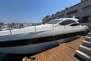 Pershing 50 Luxury 2007 Pershing 50 yacht docked at marina under clear blue sky.