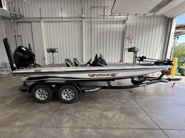 Phoenix 721 ZXL 2025 Phoenix 721 ZXL boat in a garage, side view, on a trailer.