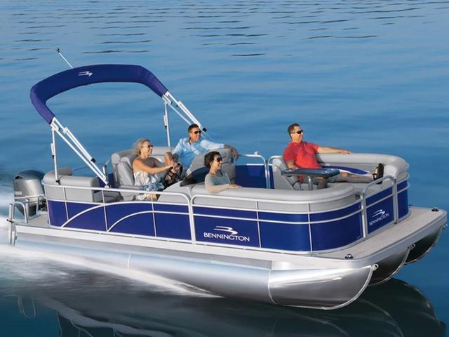 Bennington 24 SVSR 2024 Bennington 24 SVSR pontoon boat cruising on calm water with passengers.