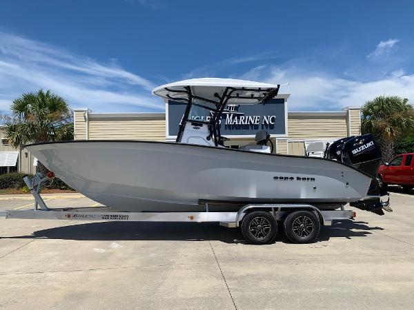Cape Horn 24 XS 2024 Cape Horn 24 XS boat on a trailer outside a marine dealership.