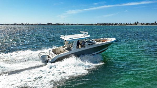 Boston Whaler 350 Realm 2019 Boston Whaler 350 Realm cruising on clear blue water.