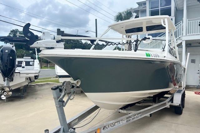 Key West 239 DFS 2018 Key West 239 DFS boat on trailer, parked outdoors near a building.