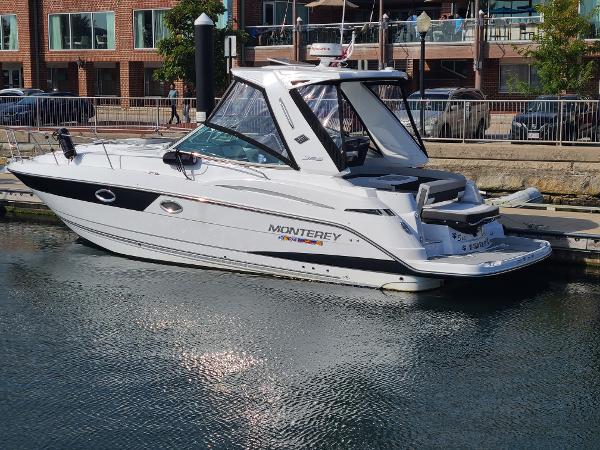 Monterey 335 Sport Yacht 2021 Monterey 335 Sport Yacht docked in a marina, showcasing sleek design and modern features.