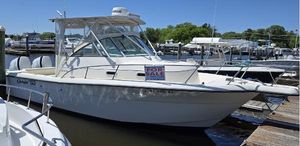 Pursuit 2870 Walkaround 1999 Pursuit 2870 Walkaround boat for sale at a marina dock.