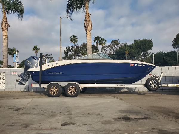 Chaparral 21 SSi OB 2020 Chaparral 21 SSi OB boat on trailer, parked outdoors.