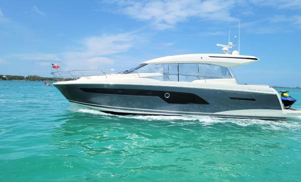 Prestige 520S 2020 Prestige 520S yacht cruising on turquoise waters under a clear blue sky.