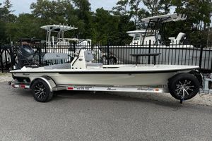 Maverick 17 HPX-S 2025 Maverick 17 HPX-S boat on trailer, parked outdoors near other boats.