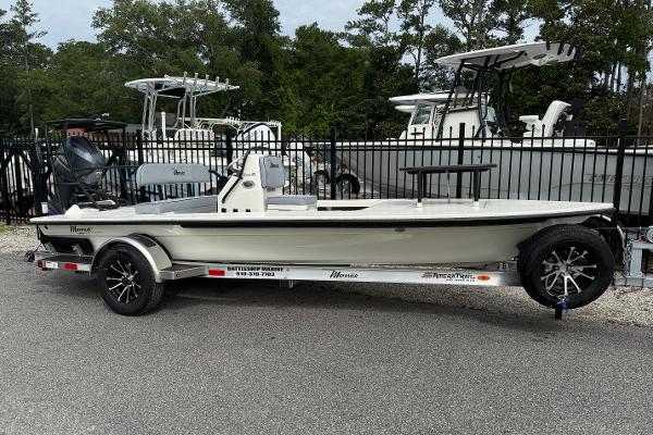 Maverick 17 HPX-S 2025 Maverick 17 HPX-S boat on trailer, parked outdoors near other boats.