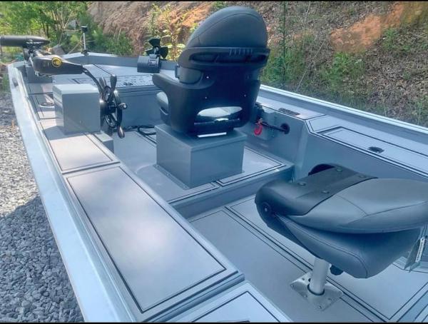 Custom 1860 Ultimate Panfish 2025 Custom 1860 Ultimate Panfish boat interior with seating and fishing equipment.