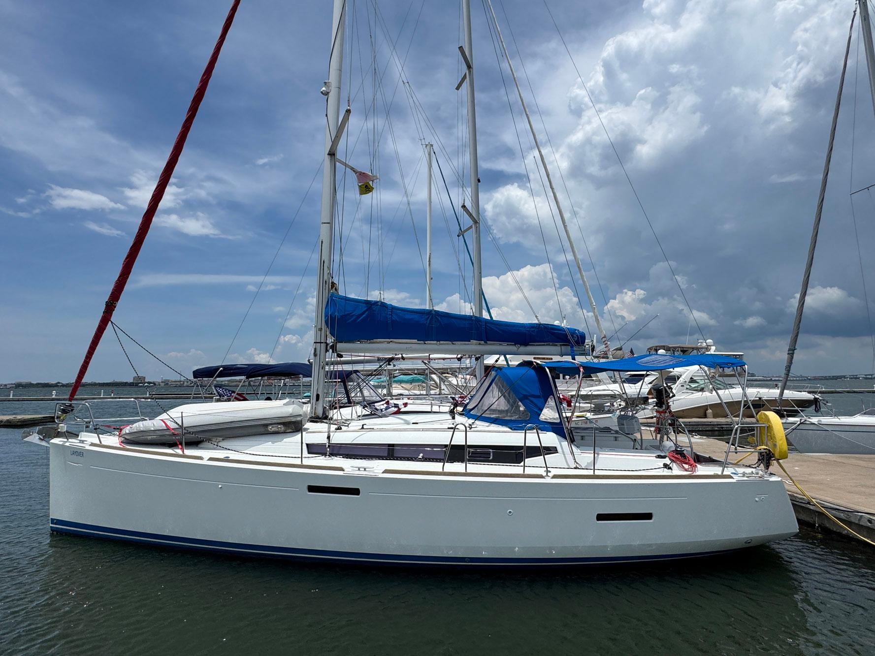 Jeanneau Sun Odyssey 389 2018 Jeanneau Sun Odyssey 389 sailboat docked under a cloudy sky.