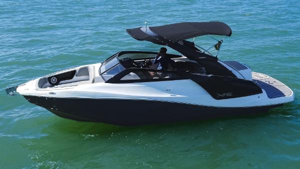 NX Boats NX 260 EVOLUTION 2025 NX Boats NX 260 EVOLUTION cruising on clear blue water.