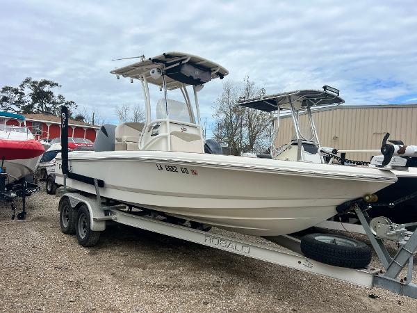 Robalo 206 Cayman 2017 Robalo 206 Cayman boat on trailer, parked outdoors.