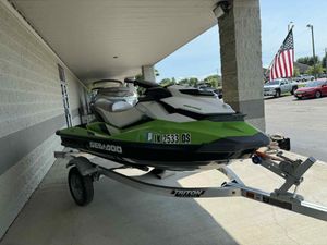 Sea-Doo GTI SE 130 2013 Sea-Doo GTI SE 130 jet ski on trailer, parked under a canopy.