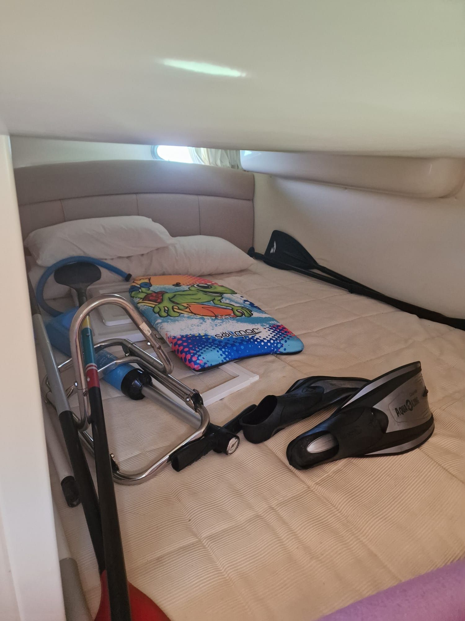 Sessa Marine Oyster 30 Interior cabin of 2005 Sessa Marine Oyster 30 with bed and snorkeling gear.