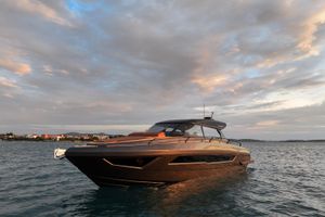 Focus 3X Luxurious 2026 Focus 3X yacht cruising on serene waters at sunset.