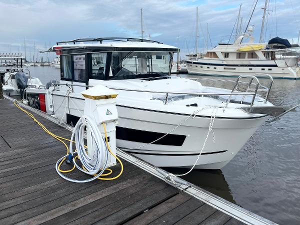 Jeanneau NC Sport 895 2024 Jeanneau NC Sport 895 docked at marina with other boats.