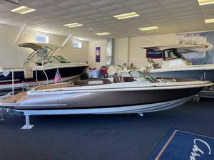 Chris-Craft Launch 27 2024 Chris-Craft Launch 27 boat displayed in a showroom.