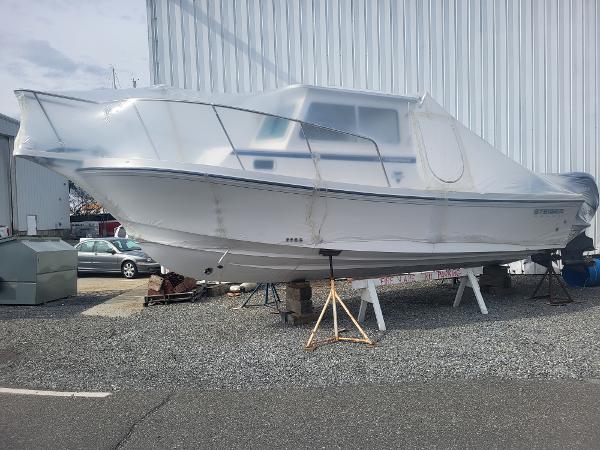 Steiger Craft 28 Fisherman 2025 Steiger Craft 28 Fisherman boat covered in protective wrap, displayed outdoors.