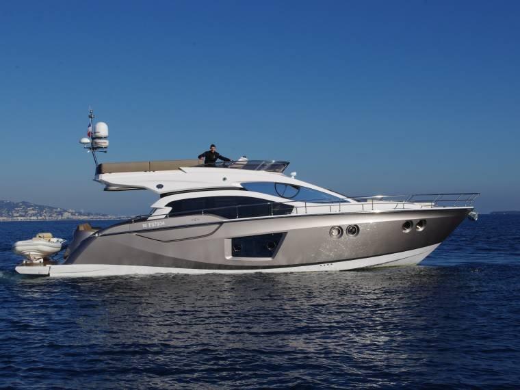 Sessa Marine F 54 2013 Sessa Marine F 54 yacht cruising on open water under clear blue skies.