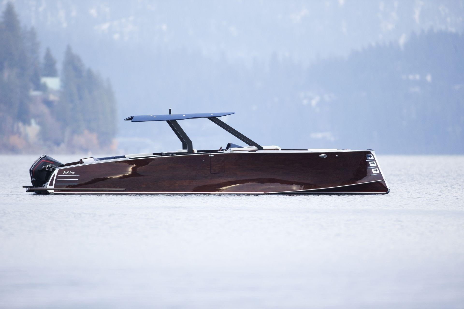 Stancraft 340 Hammerhead Center Console 2023 StanCraft 340 Hammerhead Center Console boat on a serene lake.